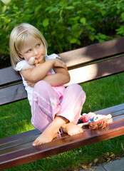girl playing with doll - obrazy, fototapety, plakaty