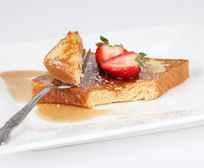 French toast with syrup and strawberry
