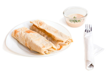 Chicken and vegetables wrapped in a pitta isolated on a white