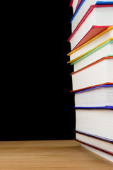 pile of books isolated on black