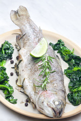 bream baked with Italian herbs and fried spinach