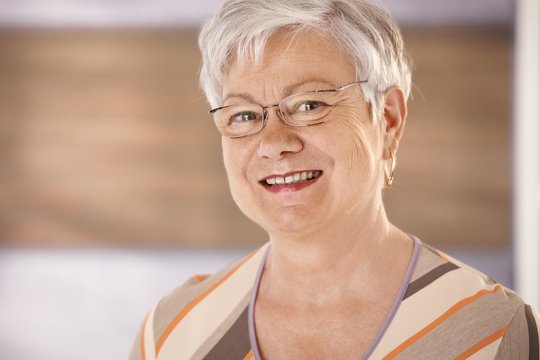 Portrait of happy senior woman with glasses