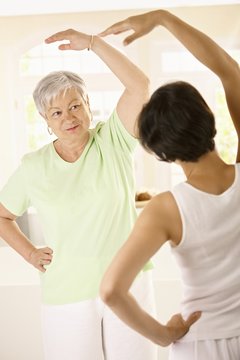 Senior woman with personal fitness trainer