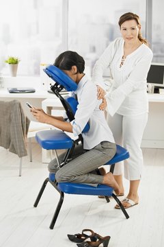 Businesswoman getting massage in office
