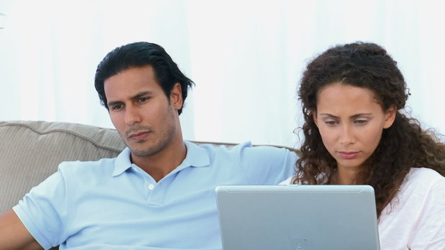 Closeup of a couple watching a video on the computer