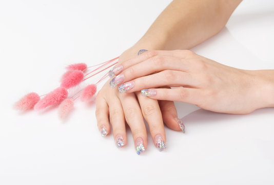 Manicure with crystalline flecks and pink decoration
