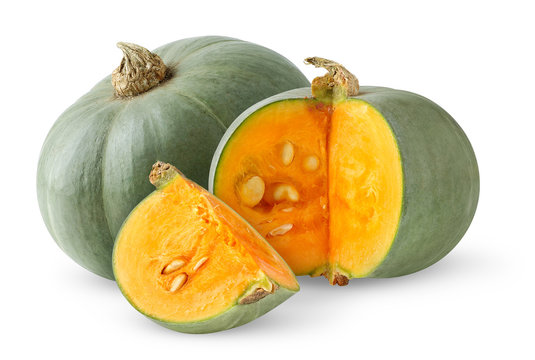 Isolated pumpkins. Two green pumpkins whole and cut isolated on white background