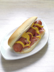 hot dog with mustard and onions