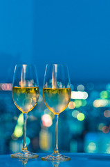 Champaign glasses in front of a window