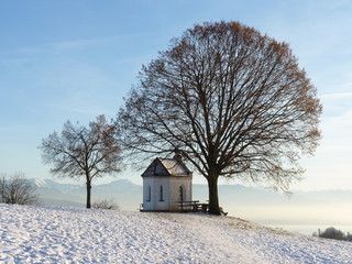 chapel in winter with mountain view