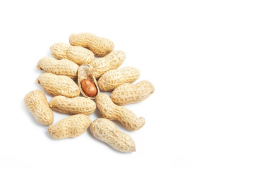 heap of peanut shells with kernel and copy space on white