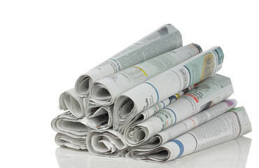 stack of newspaper over white background