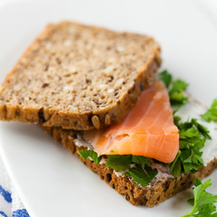 Sandwich with salmon and fresh parsley