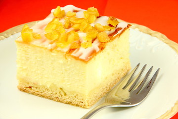Beautiful delicious cheesecake on red background