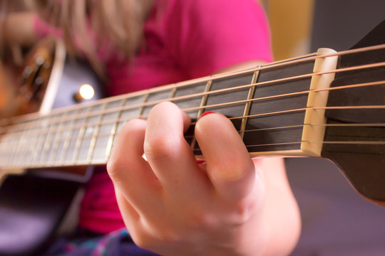 Girl's Hand on Guitar