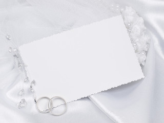 Silver wedding rings on a card