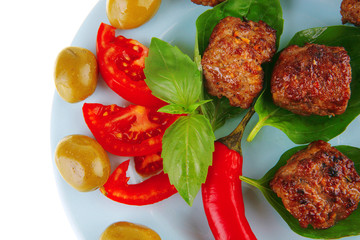 roast meat balls on basil
