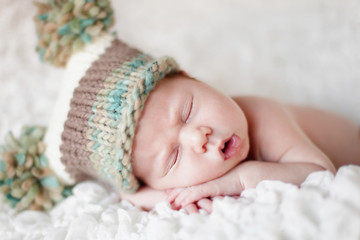 Newborn baby sleeping. Soft focus, shallow DoF.