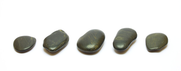 Black stones row isolated on white background