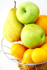 Green apples with yellow pear and tangerines