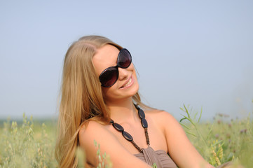 woman with glasses in the field