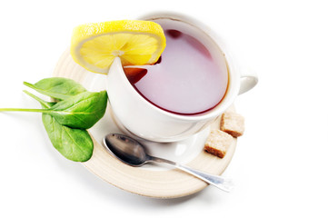 full cup of tea with lemon