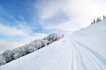 Winter road running onto hill top