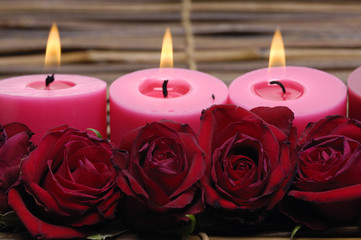 candlelight with rose on bamboo mat