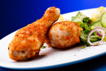 Roasted chicken drumsticks and vegetables