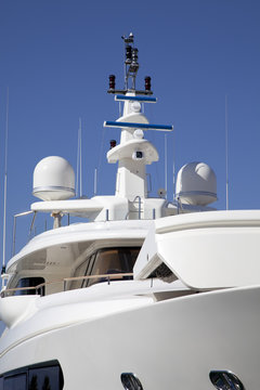 Mast of a big luxury yacht with a radar and antenna