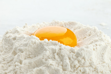 Broken egg on flour, means for making bread