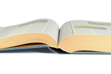 Close-up of a luxury bound open book isolated on white
