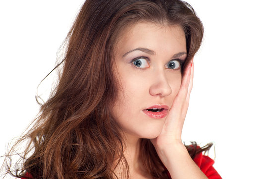Close-up of a young woman looking shocked