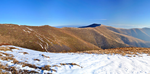 Mountain ridge and first snow panorama