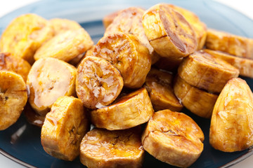 bananas in caramel lying on a plate