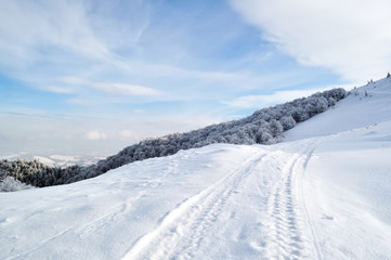 Winter road running onto hill top