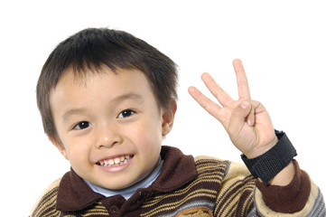 Little asian boy hold 3 fingers up