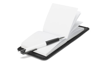 Ballpoint pen on open note pad