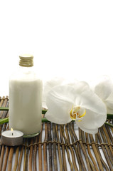 Fototapeta na wymiar massage oils in bottles with white orchid for body care