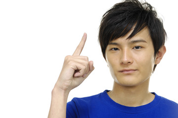 Happy smart man pointing up at copy space