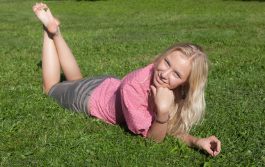 Fototapeta premium The blonde on a grass
