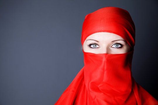 beauty young woman in red veil photo