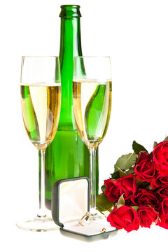 Valentine's day roses and champagne wine isolated on white
