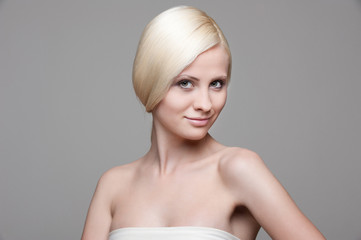 beautiful blonde over grey background