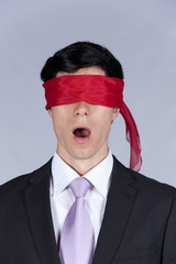 blindfold businessman
