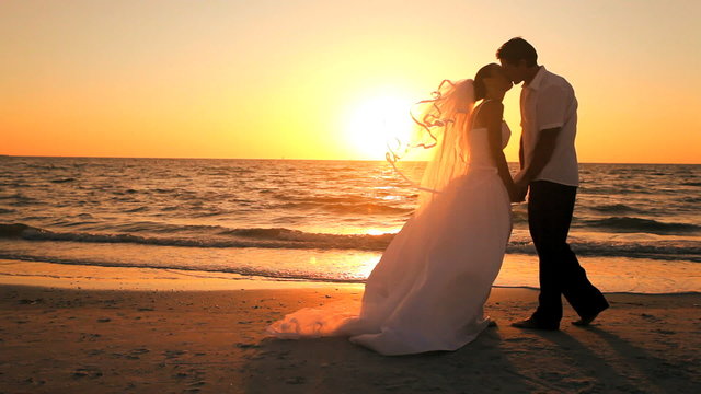 Sunset Beach Wedding Kiss