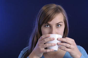 close-up of young woman drinking coffee