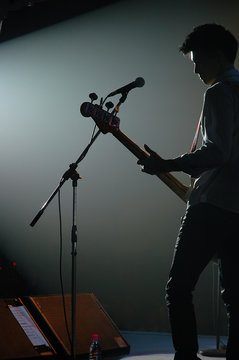 guitarist of a pop band with a guitar