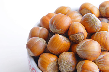 A bowl full of hazelnuts