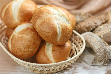 assortment of baked bread on wood table